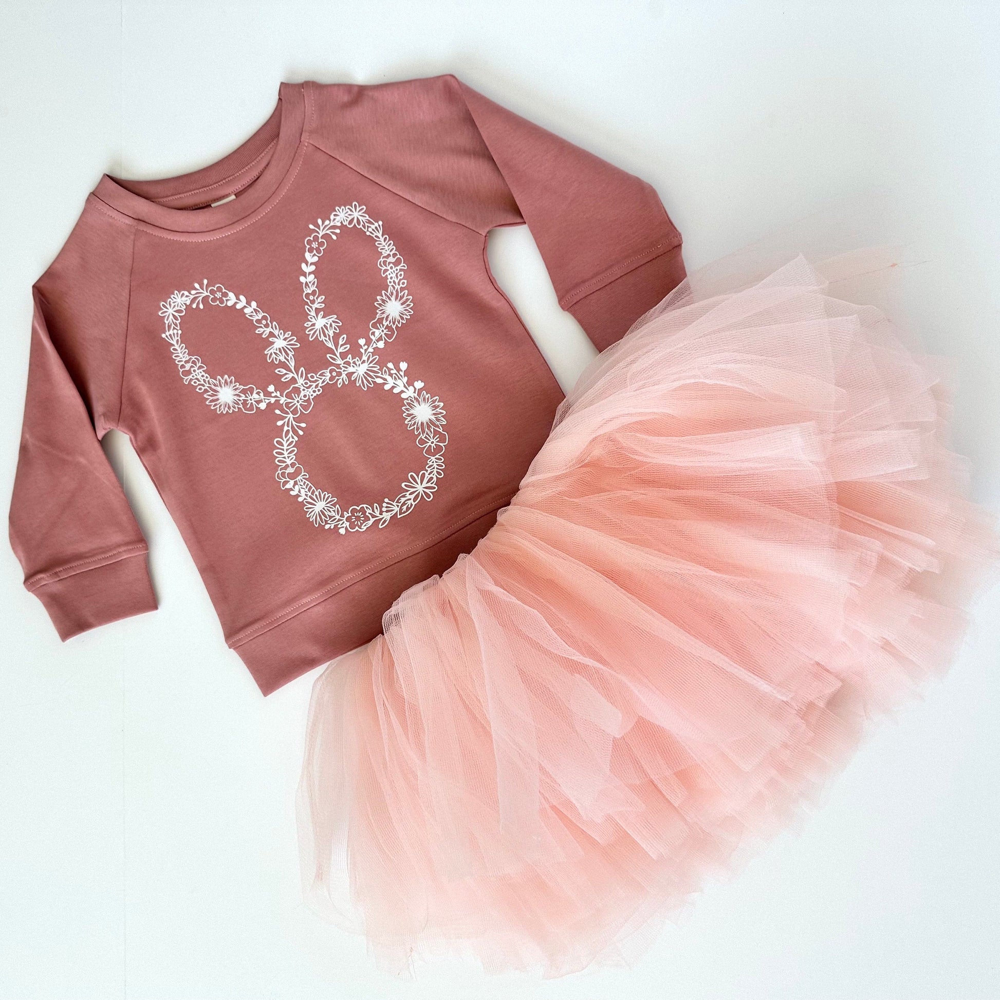 Our Dusty Mauve Organic cotton lightweight long sleeve sweatshirt with a floral bunny pairs perfect with our blush peach pink tutu. Wear together as a set or seperate for multiple options! This outfit is perfect for a spring day, Easter Sunday, or that special occasion you want your toddler or little girl to look her best!