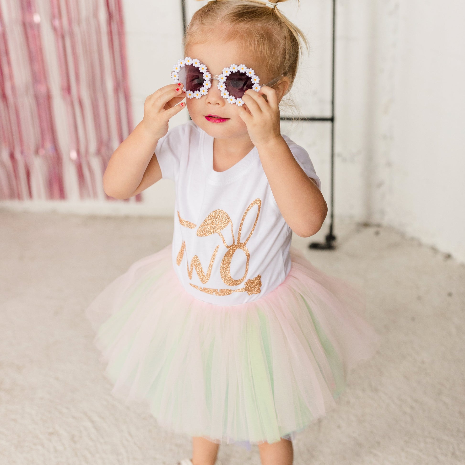 Our ten layered Pastel Rainbow tutu is a perfect addition to anyones wardrobe.  The soft pastel pink, green, purple, blue and white goes with many spring outfits! The fluffy bunny cottontail is removable for a easy transitional piece.