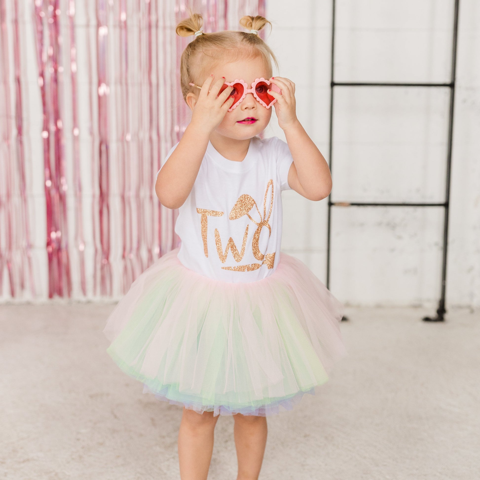 Our ten layered Pastel Rainbow tutu is a perfect addition to anyones wardrobe.  The soft pastel pink, green, purple, blue and white goes with many spring outfits! The fluffy bunny cottontail is removable for a easy transitional piece.