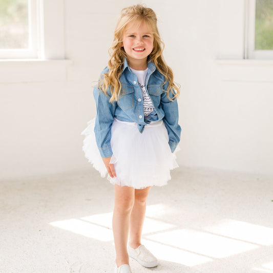 Light up the room with this White tutu! Made with layers of soft, high-quality tulle, this tutu adds a playful pop of color to any outfit. Whether you're planning a photoshoot, attending a party, or looking for the perfect accessory for a themed event, this tutu is sure to make a statement. Our waistband is a comfortable  fit. With the full layers, our tutus are twirl-worthy!