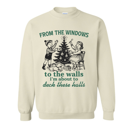 Beige sweatshirt with Christmas-themed graphic and text on a white background