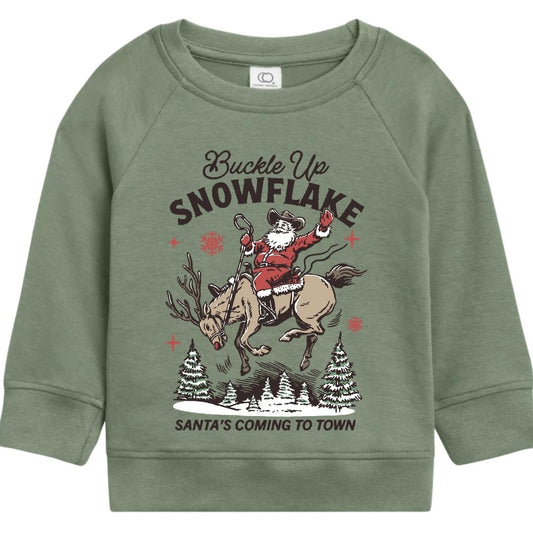 Green organic cotton kids Christmas sweatshirt with “Buckle Up Snowflake” graphic of Santa riding reindeer.