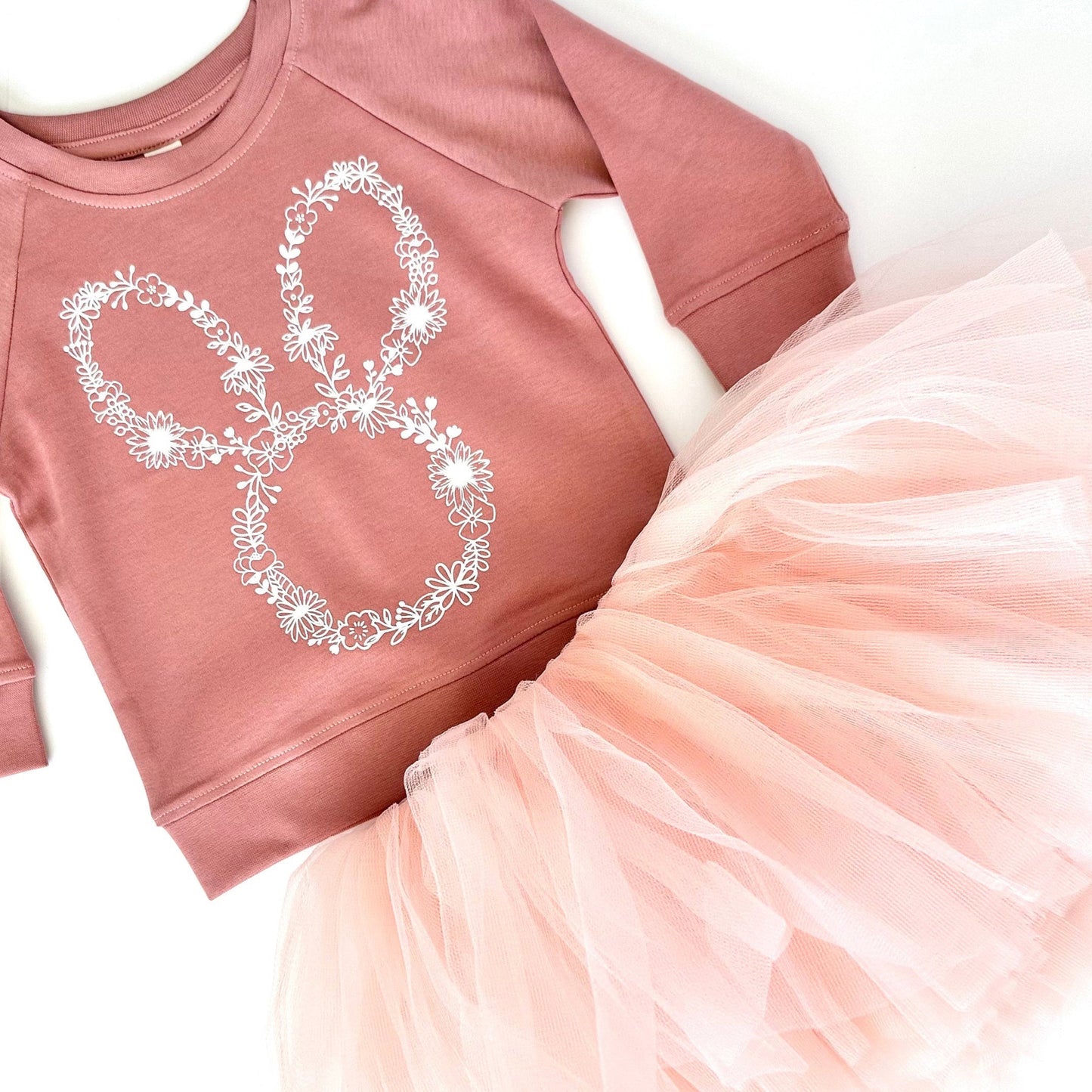 Our Dusty Mauve Organic cotton lightweight long sleeve sweatshirt with a floral bunny pairs perfect with our blush peach pink tutu. Wear together as a set or seperate for multiple options! This outfit is perfect for a spring day, Easter Sunday, or that special occasion you want your toddler or little girl to look her best!
