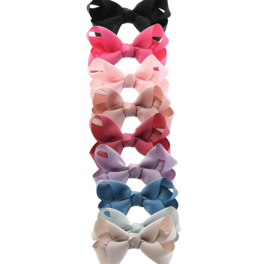 Set of colorful solid hair bows for girls, 2.75 inch wide with metal alligator clips. Perfect toddler and kids hair accessories for everyday wear, parties, and school.