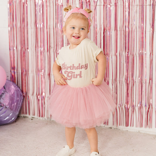 Our most popular birthday outfit! The mauve pink tutu paired with an ivory organic cotton t-shirt with matching mauve pink Birthday Babe is a perfect outfit to celebrate your little one's special day!