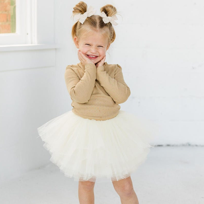 This beautiful rich ivory tutu is a perfect addition to any little ones wardrobe. This tutu will go with everything! Pair with your favorite holiday top or wear to a more formal event.