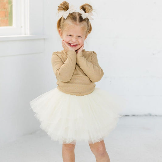 This beautiful rich ivory tutu is a perfect addition to any little ones wardrobe. This tutu will go with everything! Pair with your favorite holiday top or wear to a more formal event.