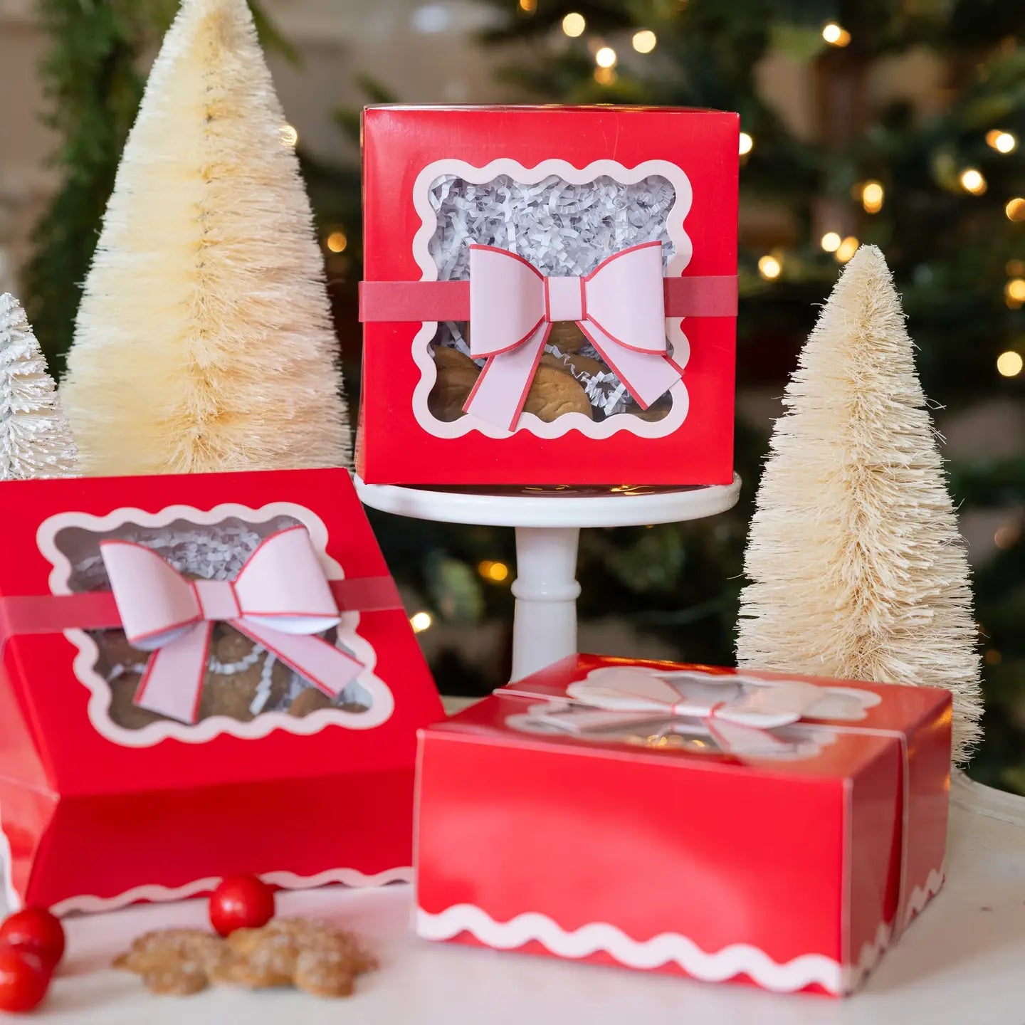 Red gift boxes with white bows on a festive background