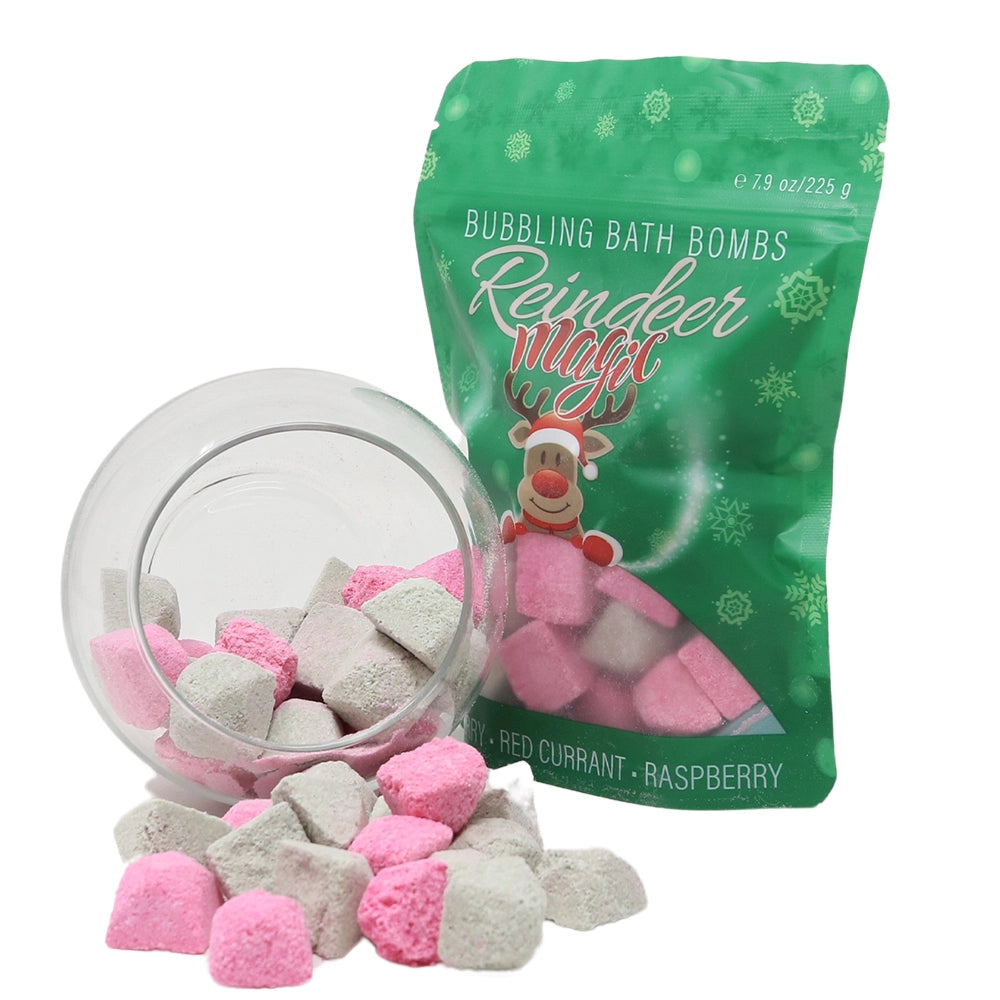 Bubbling bath bombs with a green packaging labeled 'Reindeer Magic' on a white background