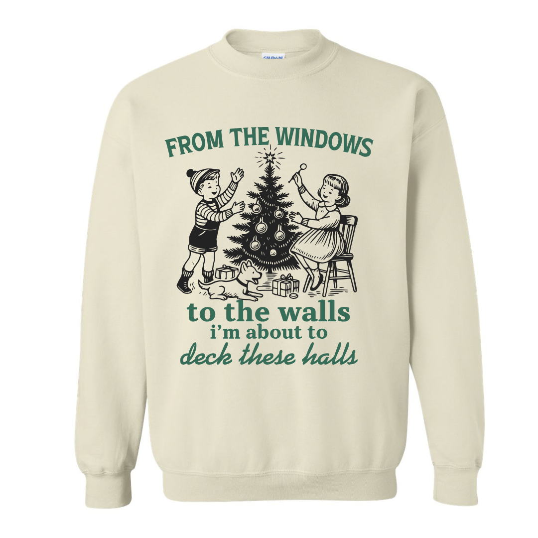 Beige sweatshirt with Christmas-themed graphic and text on a white background
