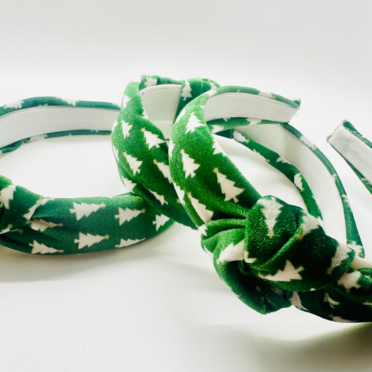 Green velvet headband with white Christmas tree pattern and top knot