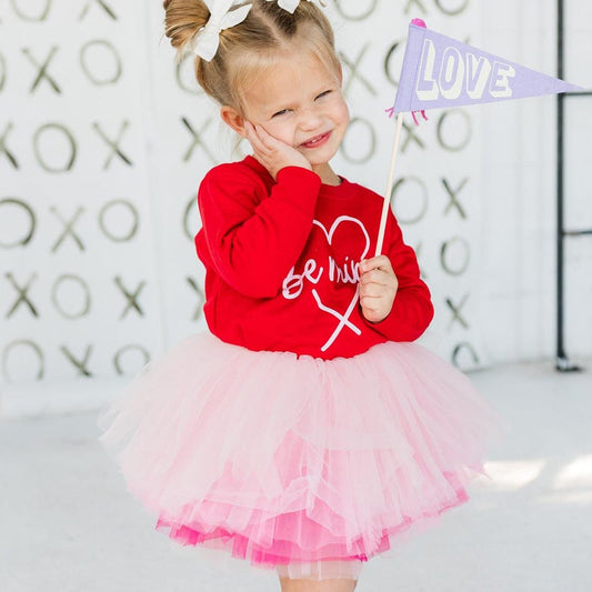 The perfect outfit for Valentines. With our most popular Poppin Pink tutu paired with our Red crew sweatshirt with pink Be Mine Print. Wear together or separates! 