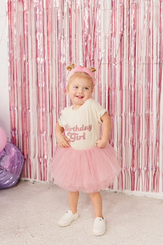 Our most popular birthday outfit! The mauve pink tutu paired with an ivory organic cotton t-shirt with matching mauve pink Birthday Babe is a perfect outfit to celebrate your little one's special day! 