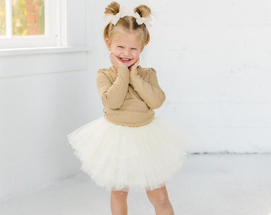 This beautiful rich ivory tutu is a perfect addition to any little ones wardrobe. This tutu will go with everything! Pair with your favorite holiday top or wear to a more formal event. 