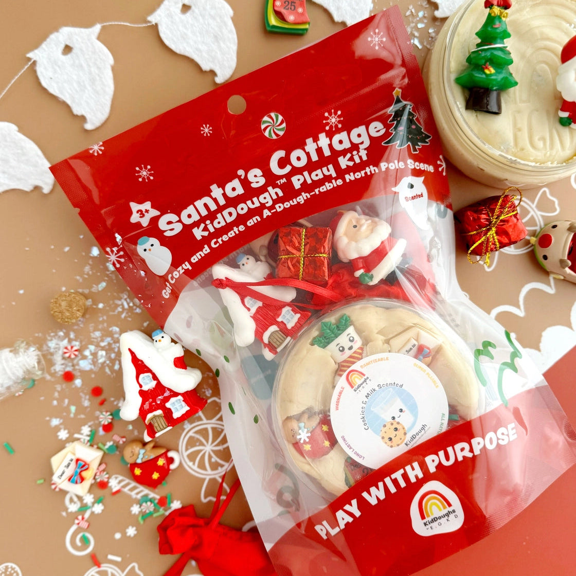 Santa's Cottage play dough kit with Christmas-themed decorations on a brown background