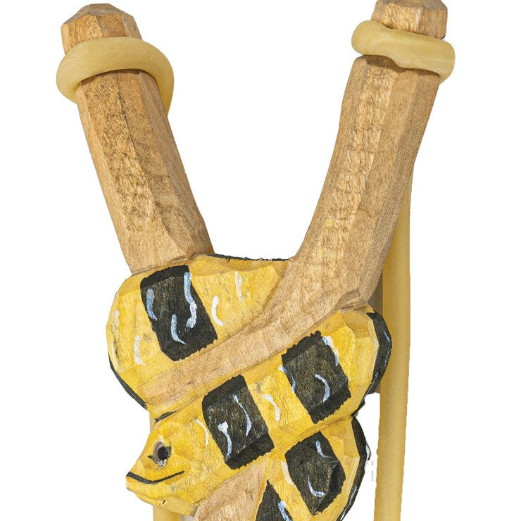 Wooden slingshot with a yellow and black design on a white background