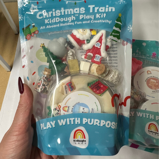 Christmas Train KidDough Play Kit packaging held by a hand
